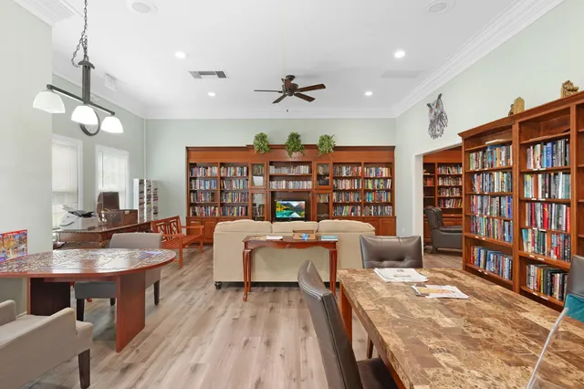 a view of a street with potted plants