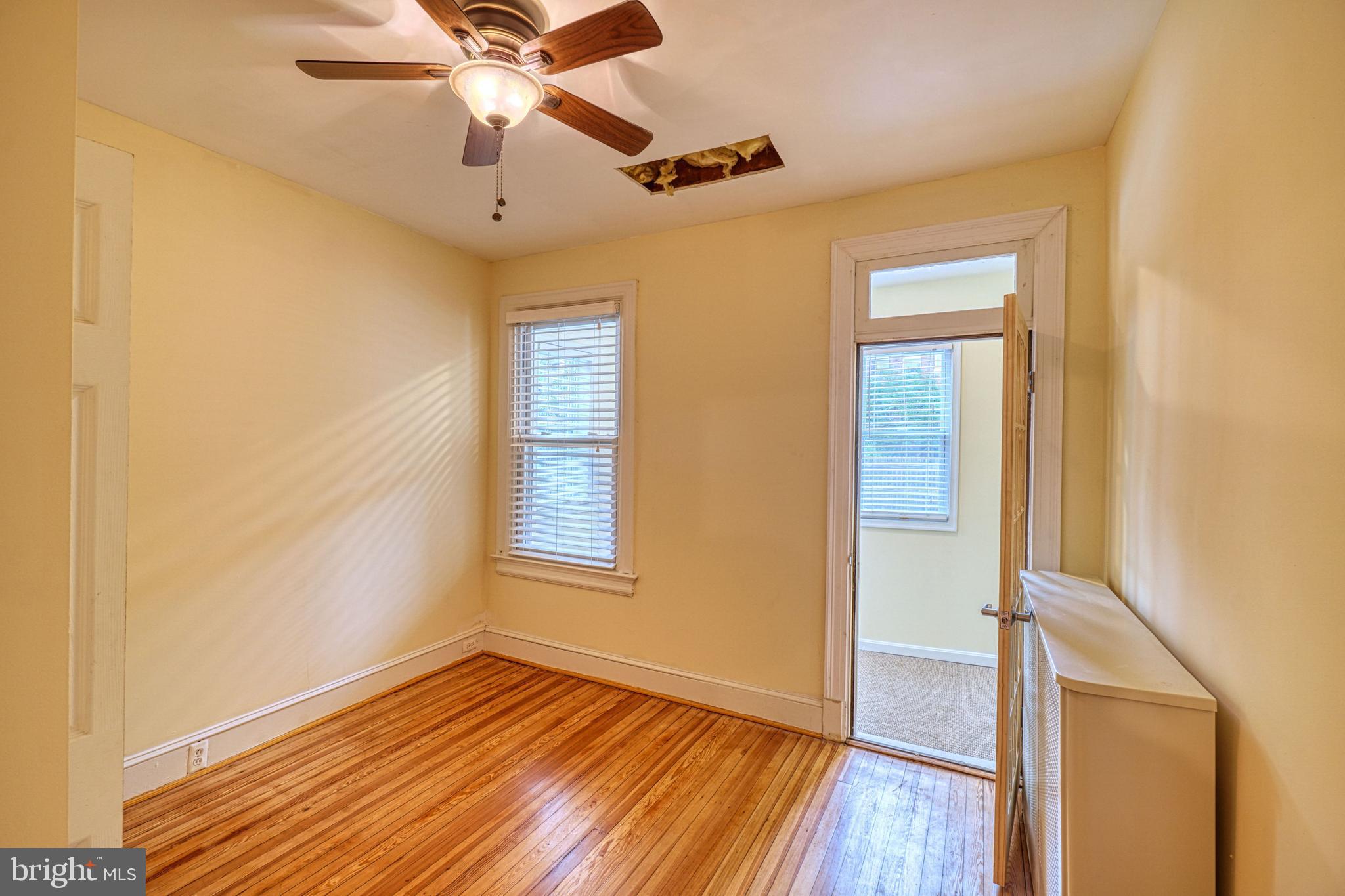1821 Kilbourne Place Northwest Washington, DC 20010 - Photo 19 of 40 a view of an empty room with wooden floor and a window