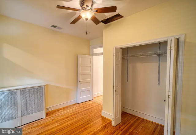 a view of a room that has a window in it