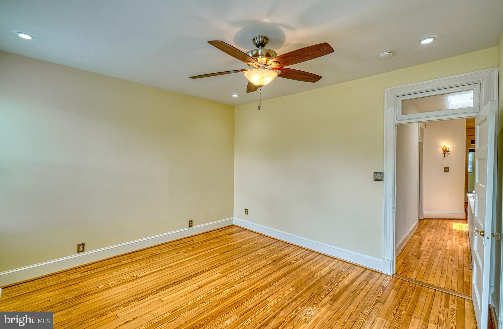 1821 Kilbourne Place Northwest Washington, DC 20010 - Photo 23 of 40 a view of a room with wooden floor and a ceiling fan