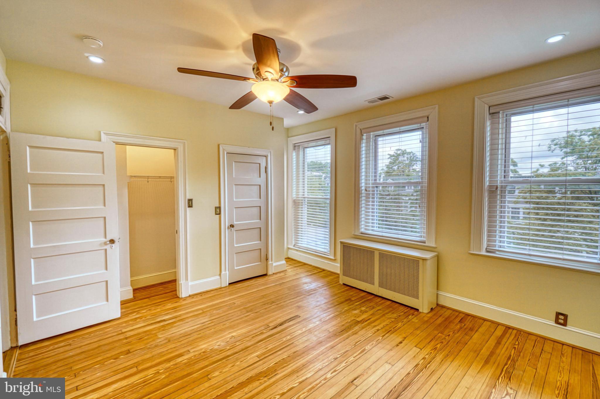 1821 Kilbourne Place Northwest Washington, DC 20010 - Photo 25 of 40 a view of an empty room with a window and wooden floor