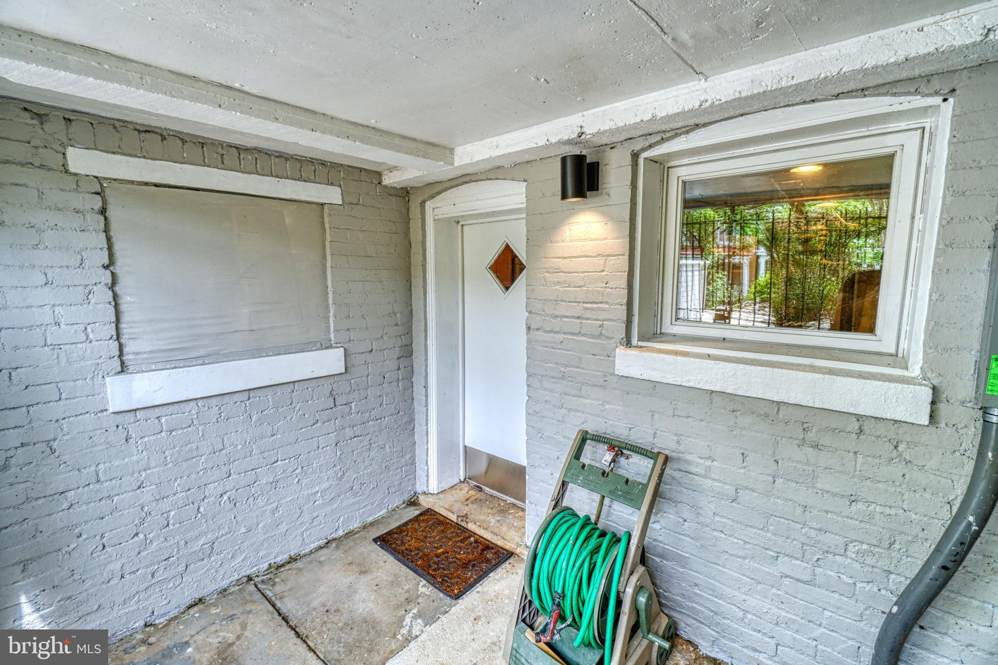 1821 Kilbourne Place Northwest Washington, DC 20010 - Photo 36 of 40 a view of a door and chair in the patio