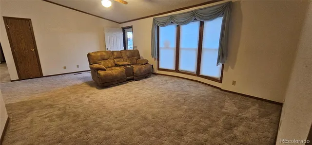 a view of room with window and couch