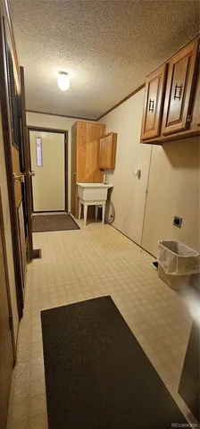 a bathroom with a sink and cabinets