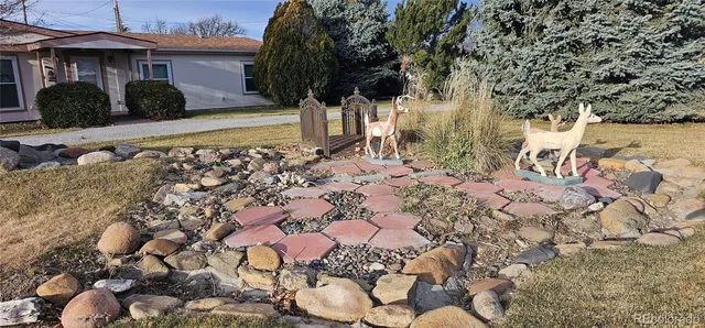 a view of a backyard of the house