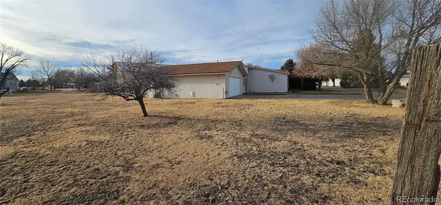 a house view with a backyard space