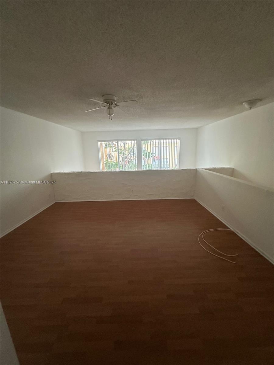 17911 Northwest 68th Avenue, Unit N206 Hialeah, FL 33015 - Photo 5 of 10 en empty room with windows