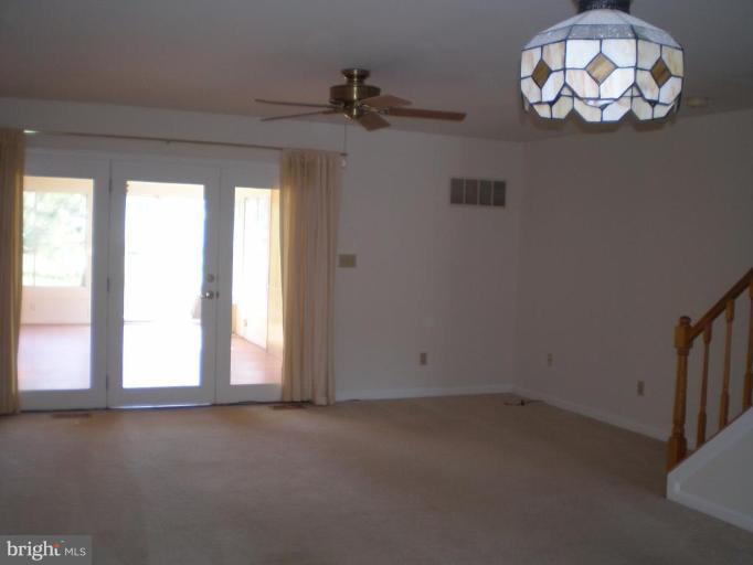 7012 Bridgepointe Drive, Unit 52 Chester, MD 21619 - Photo 3 of 12 an empty room with a window