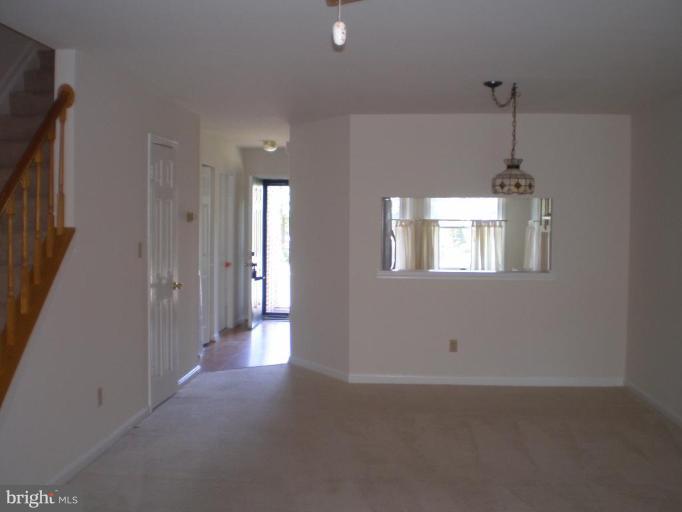 7012 Bridgepointe Drive, Unit 52 Chester, MD 21619 - Photo 6 of 12 a view of a hallway with windows
