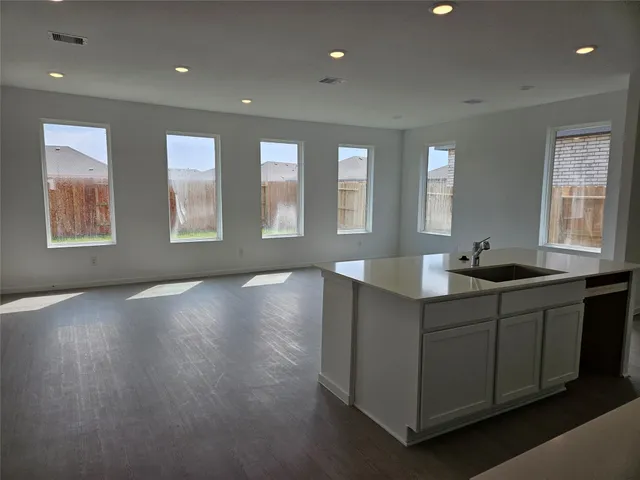a kitchen with sink and window