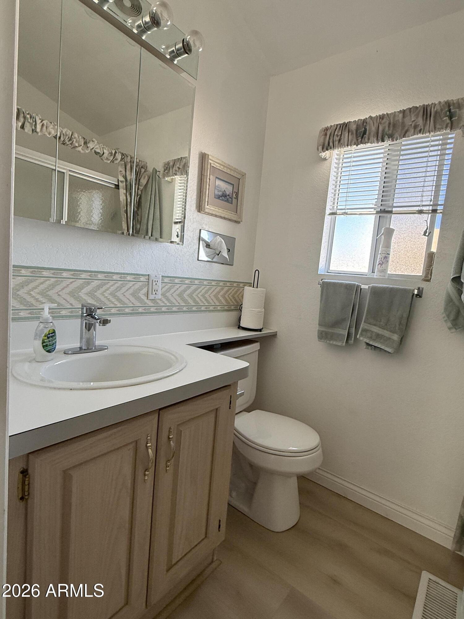 21340 Trading Post Trail Congress, AZ 85332 - Photo 15 of 31 a bathroom with a sink toilet and mirror