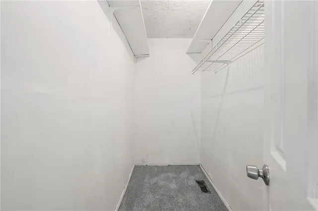 a view of a house with a yard and tree s