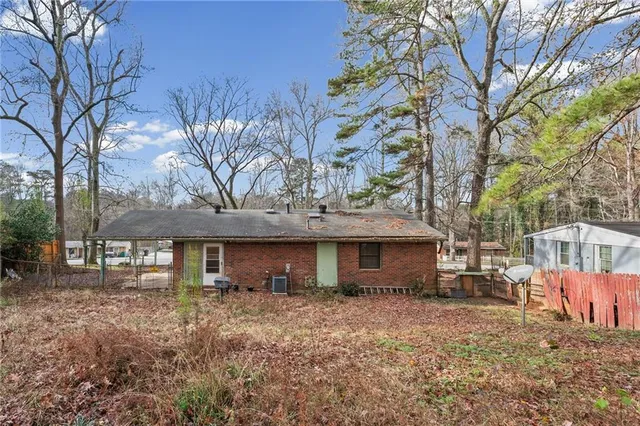a backyard of a house with lots of green space