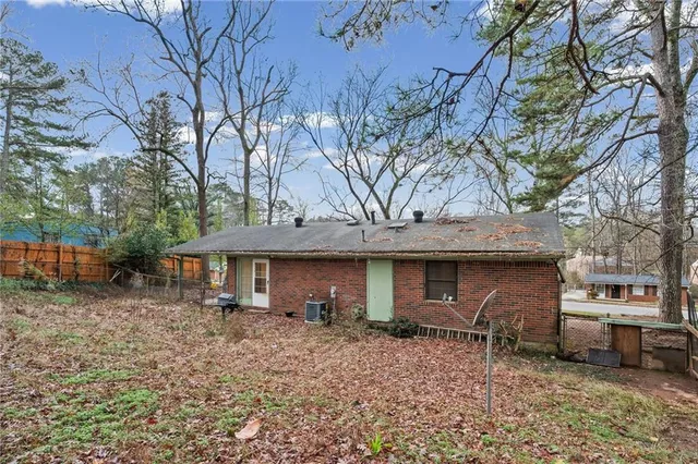 a backyard of house with trees