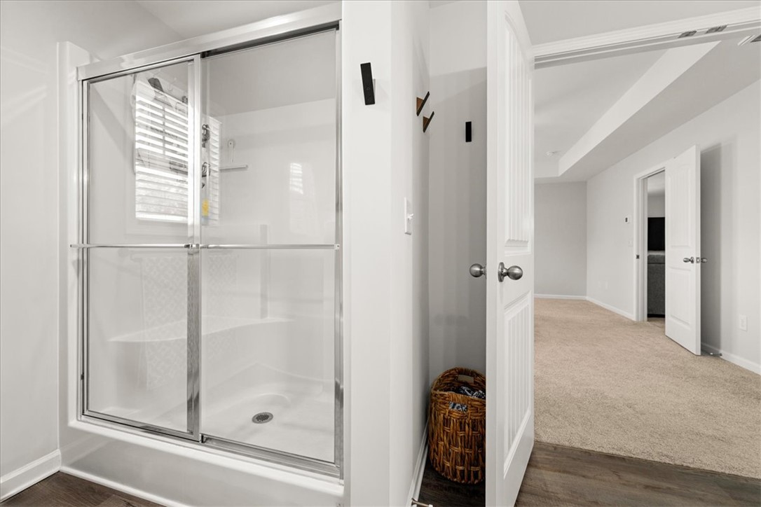 216 Carvel Trail Seneca, SC 29678 - Photo 28 of 46 This bathroom features a contemporary shower with a glass enclosure and practical design.