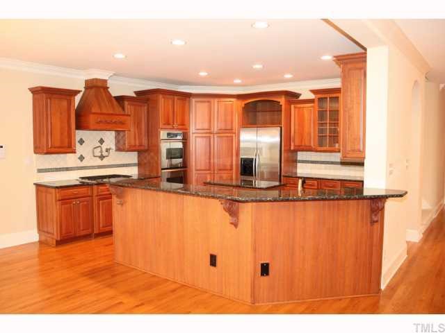 1821 Middlebrook Drive Raleigh, NC 27615 - Photo 2 of 12 a kitchen with stainless steel appliances granite countertop a sink and cabinets