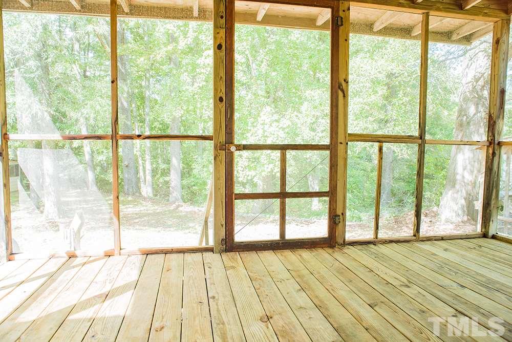 2900 Dink Ashley Road Timberlake, NC 27583 - Photo 12 of 15 a view of an empty room with wooden floor and a window