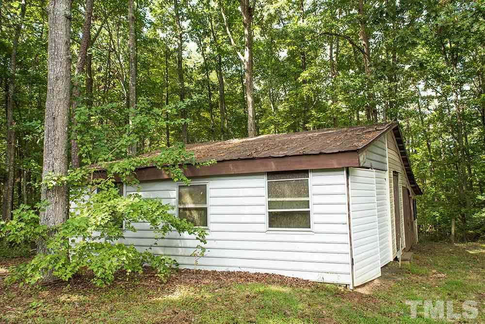 2900 Dink Ashley Road Timberlake, NC 27583 - Photo 14 of 15 a view of a house with a yard