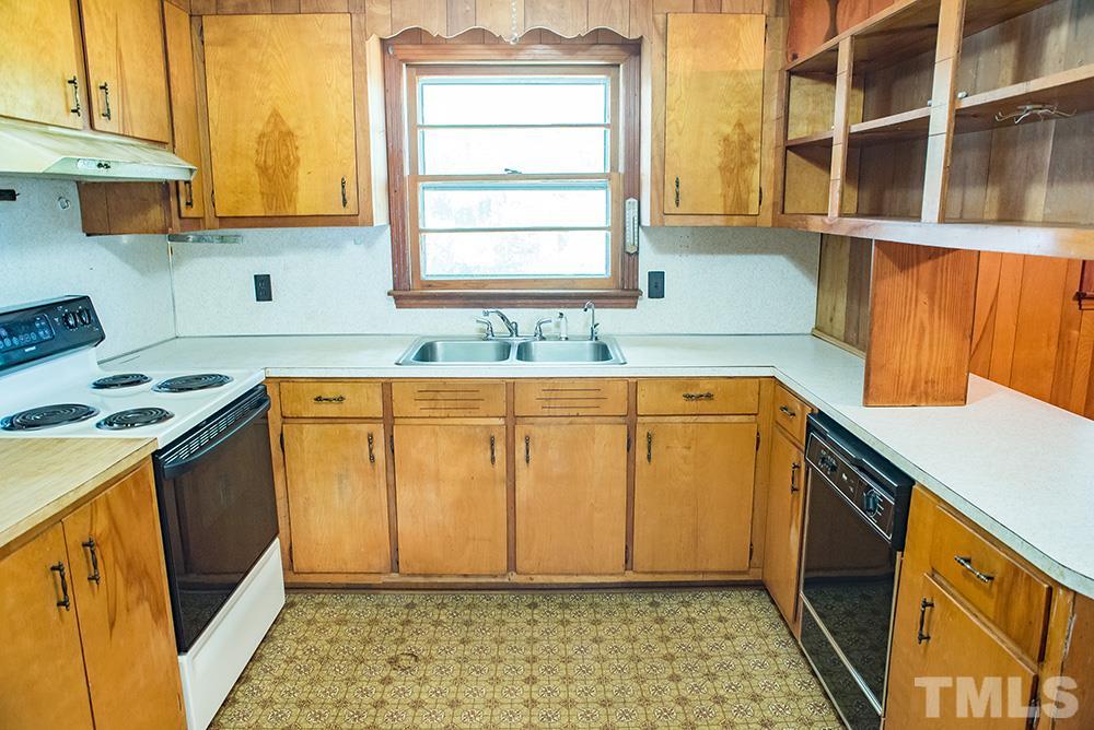 2900 Dink Ashley Road Timberlake, NC 27583 - Photo 5 of 15 a utility room with a sink a washer and dryer next to a window