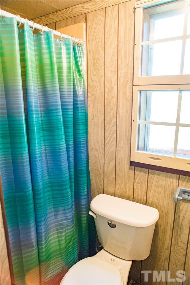 2900 Dink Ashley Road Timberlake, NC 27583 - Photo 10 of 15 a bathroom with a toilet and a shower