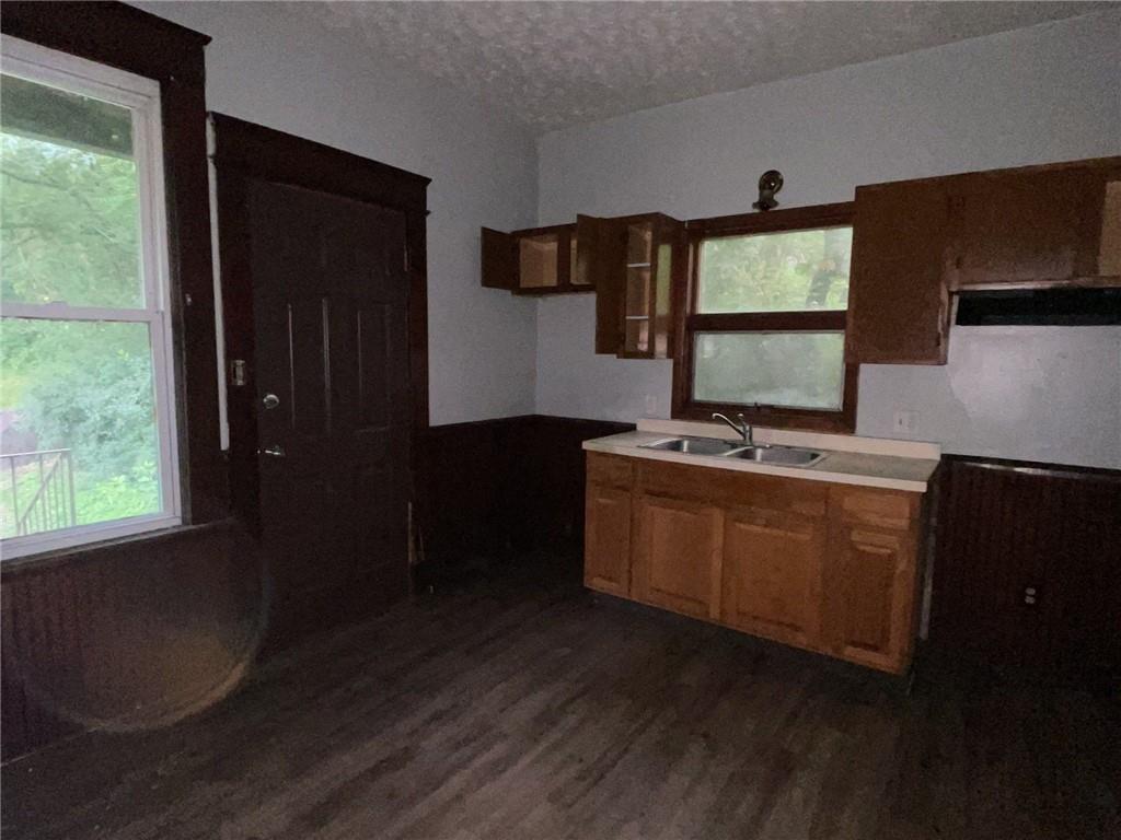 425 East Reynolds Street New Castle, PA 16101 - Photo 5 of 13 a room with wooden floor and windows