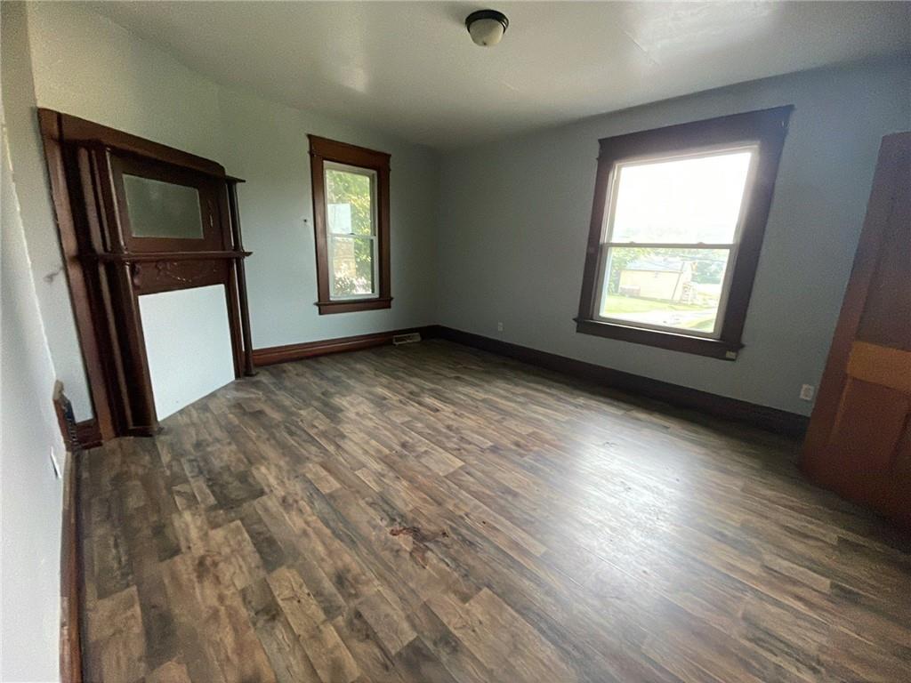425 East Reynolds Street New Castle, PA 16101 - Photo 10 of 13 an empty room with wooden floor and a window
