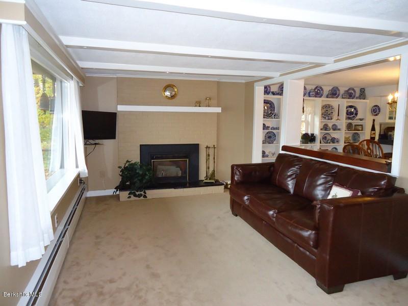 2359 North Main Road Otis, MA 01253 - Photo 13 of 32 a living room with furniture and a fireplace