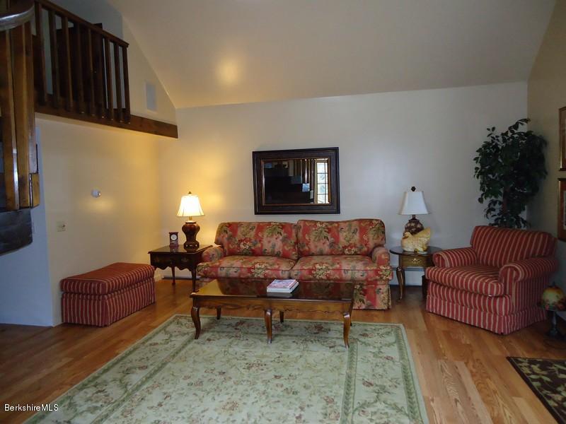 2359 North Main Road Otis, MA 01253 - Photo 27 of 32 a living room with furniture rug and lamp