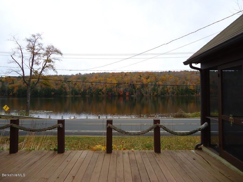 2359 North Main Road Otis, MA 01253 - Photo 8 of 32 a lake view with a wooden floor and lake view