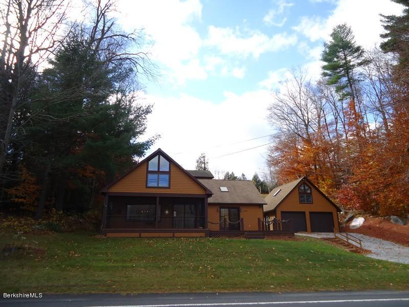 2359 North Main Road Otis, MA 01253 - Photo 9 of 32 a front view of a house with garden
