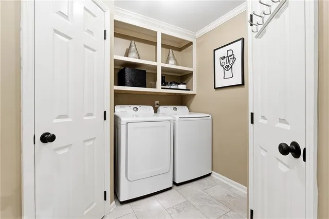 a view of bathroom with a washer and dryer