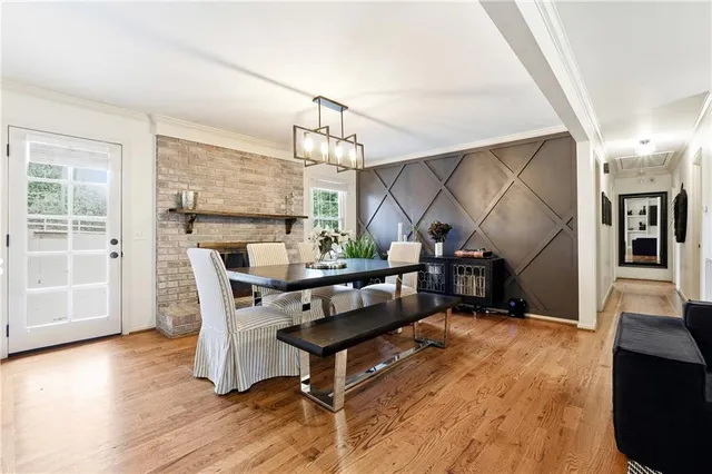 a view of entryway dining room and hall with wooden floor