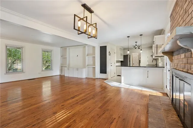 a view of a kitchen with a sink and a window