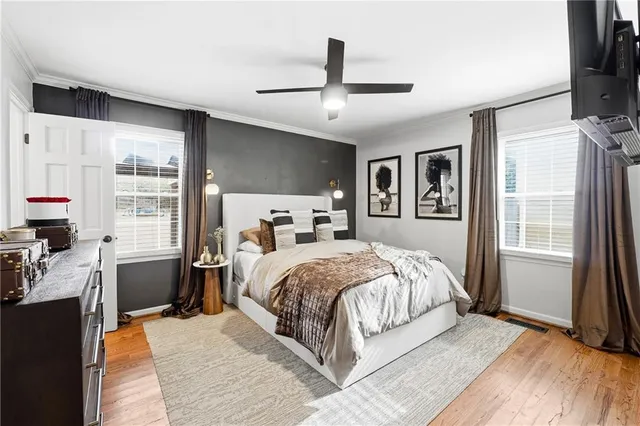 a bedroom with a large bed and a large window