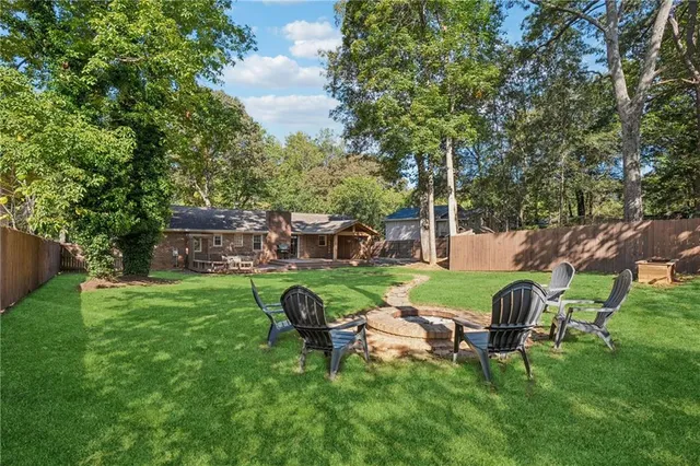 a view of a wooden bench sitting in the garden