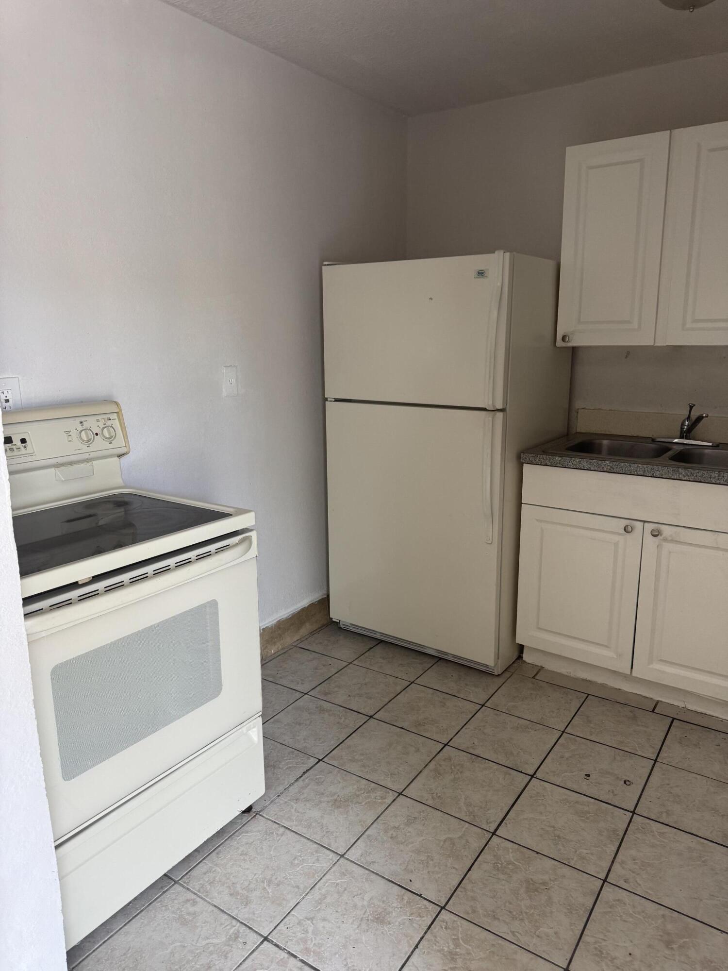 3500 Riverside Drive, Unit 13 Coral Springs, FL 33065 - Photo 14 of 15 a utility room with dryer and washer