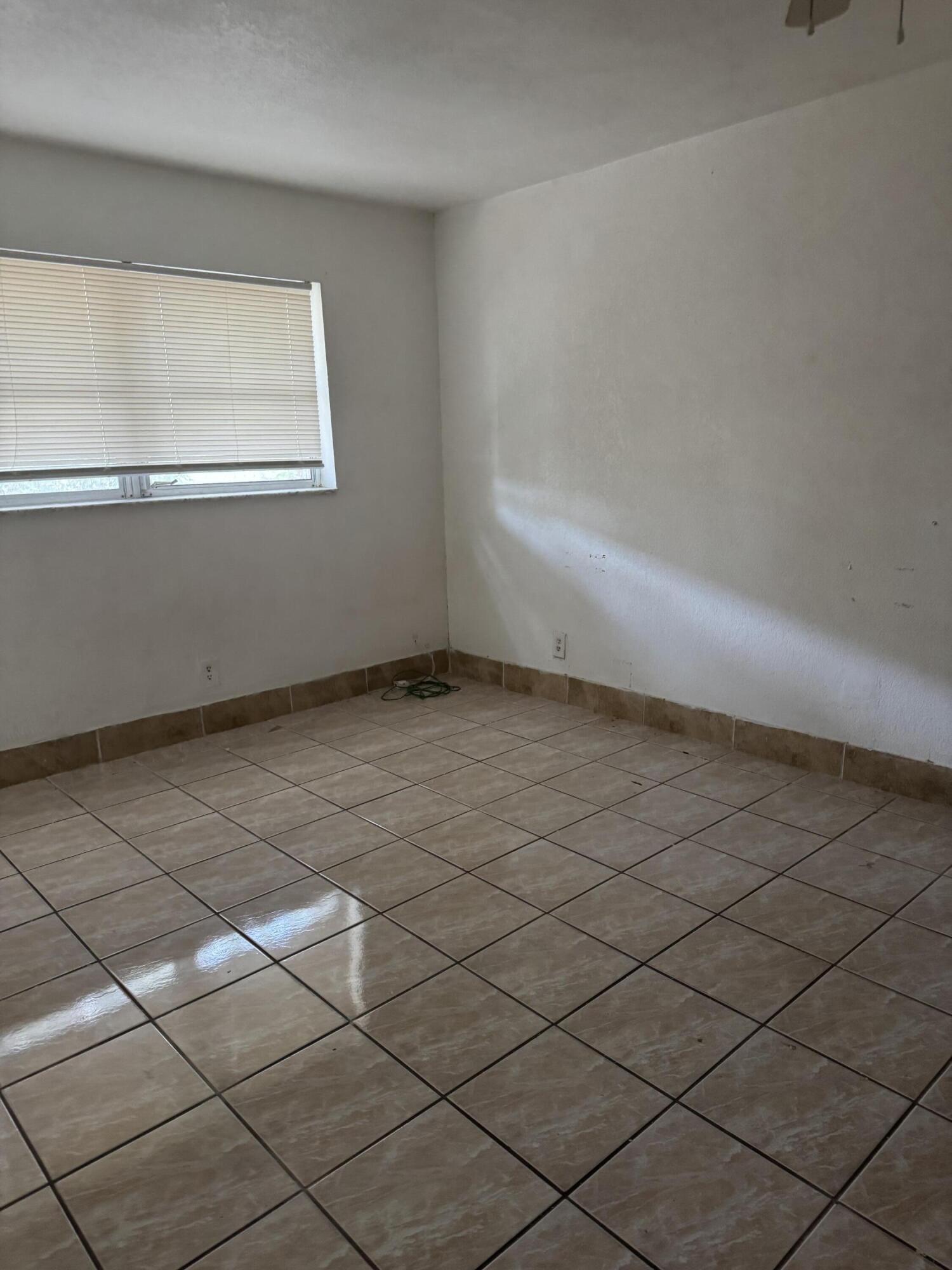 3500 Riverside Drive, Unit 13 Coral Springs, FL 33065 - Photo 8 of 15 a view of an empty room and window