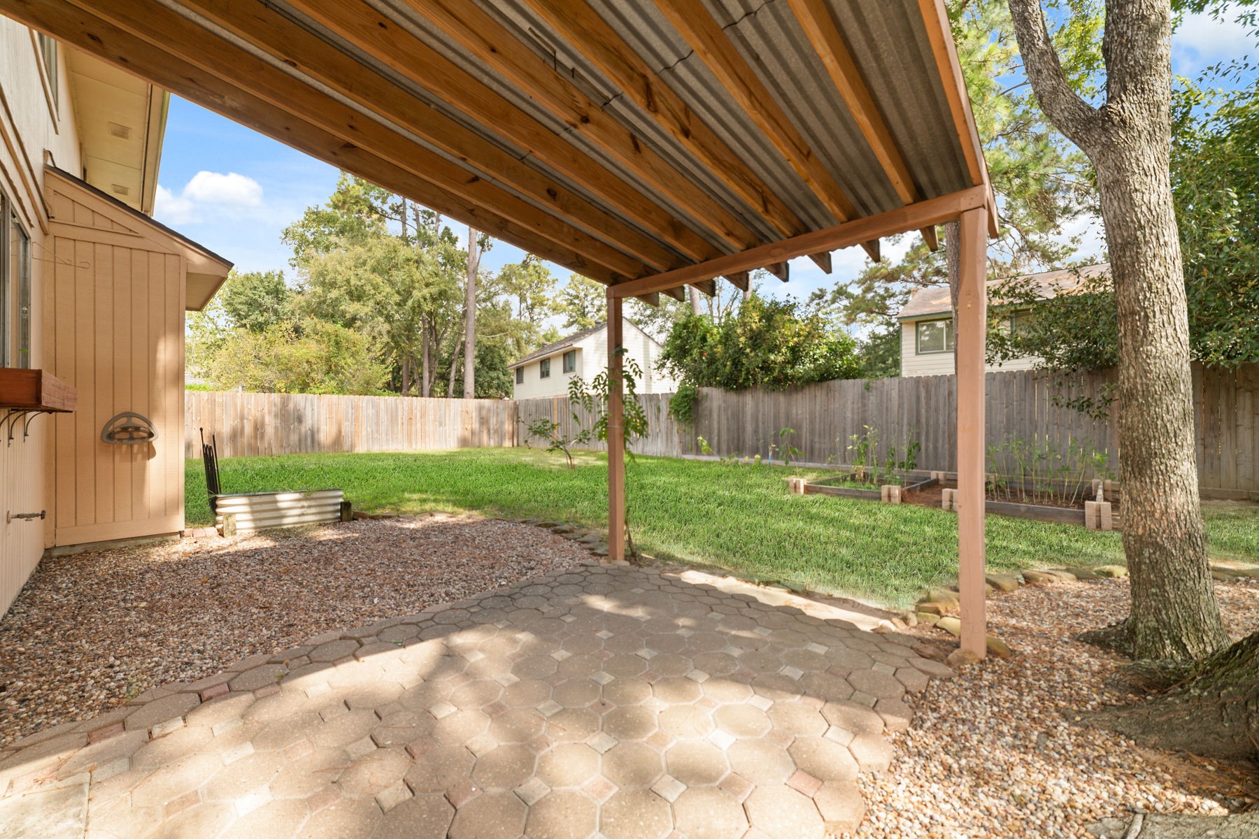 25402 Mill Pond Lane Spring, TX 77373 - Photo 7 of 22 a view of a backyard with wooden fence