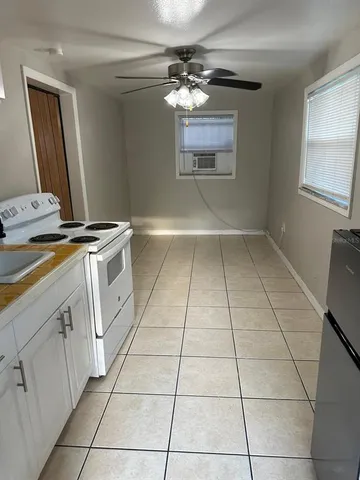 a view of cabinets and window