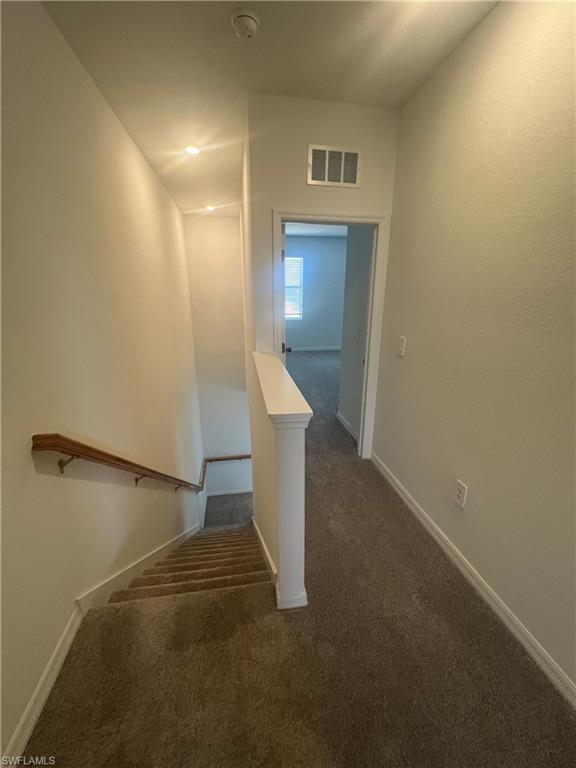 2971 Citrus Street Naples, FL 34120 - Photo 13 of 42 a view of a hallway with staircase