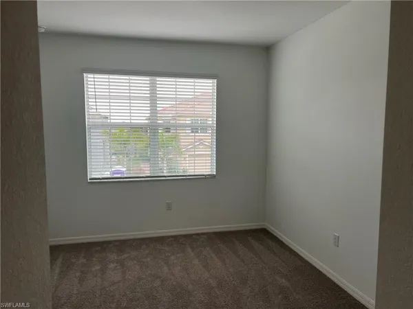 a spacious bathroom with a double vanity sink and mirror