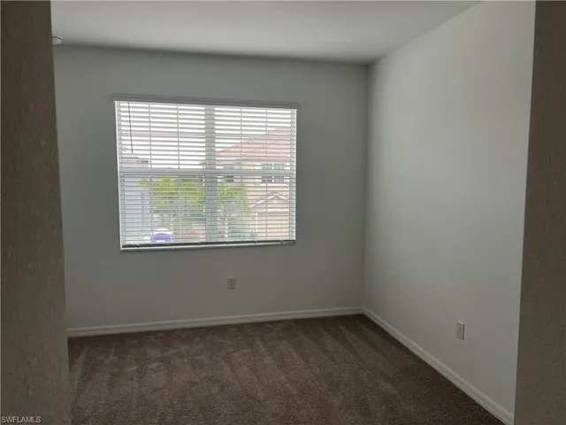 a spacious bathroom with a double vanity sink and mirror