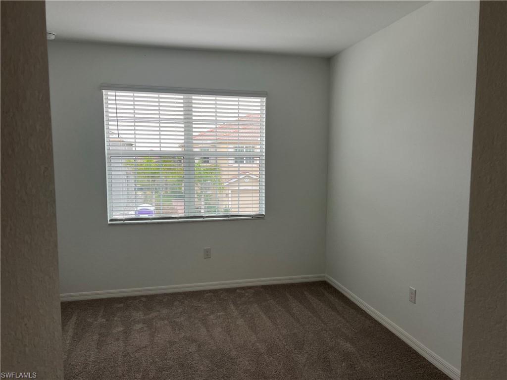 2971 Citrus Street Naples, FL 34120 - Photo 19 of 42 an empty room with a window