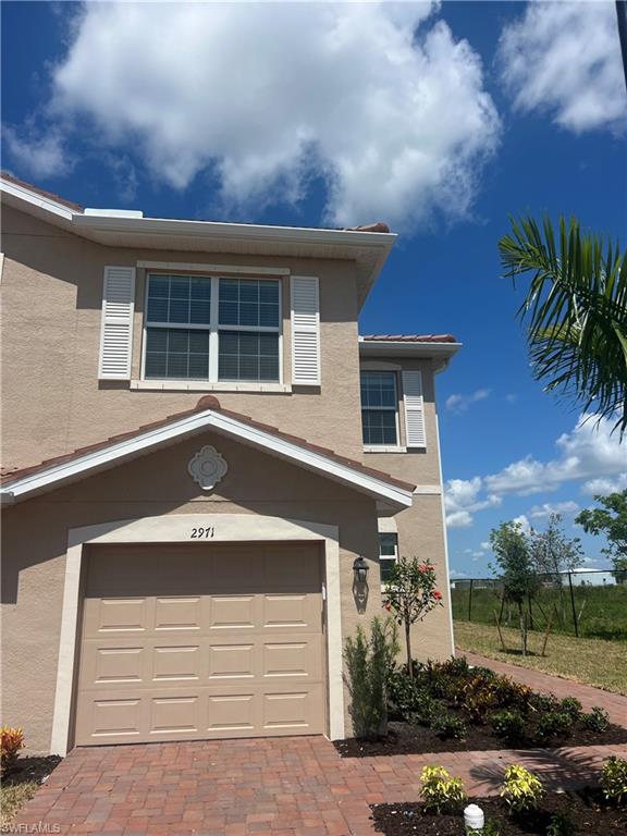 2971 Citrus Street Naples, FL 34120 - Photo 2 of 42 front view of house with a yard