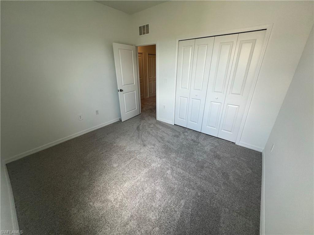 2971 Citrus Street Naples, FL 34120 - Photo 20 of 42 an empty room with closet area