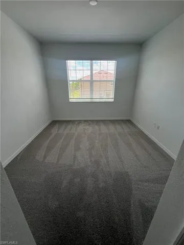 an empty room with closet area