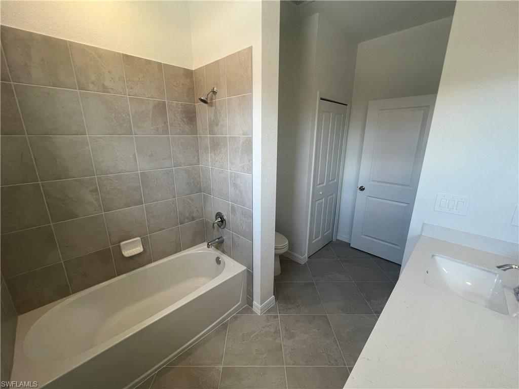2971 Citrus Street Naples, FL 34120 - Photo 25 of 42 a bathroom with a bathtub and a shower