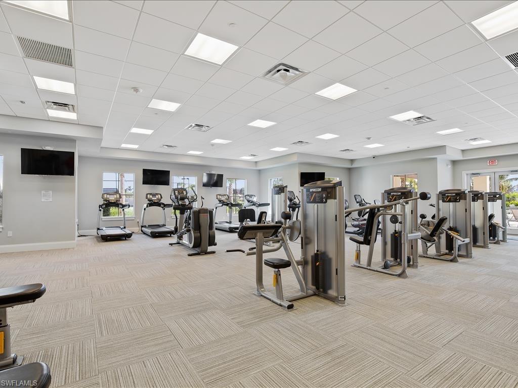 2971 Citrus Street Naples, FL 34120 - Photo 37 of 42 a view of a room with gym equipment and a large window