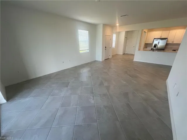 an empty room with a bathroom