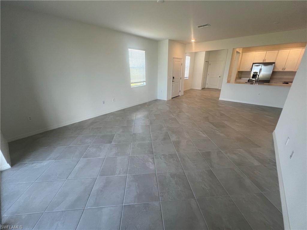 2971 Citrus Street Naples, FL 34120 - Photo 6 of 42 a view of a livingroom with wooden floor and windows